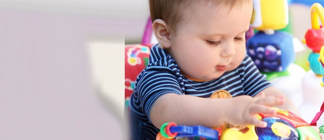 Baby surrounded by toys